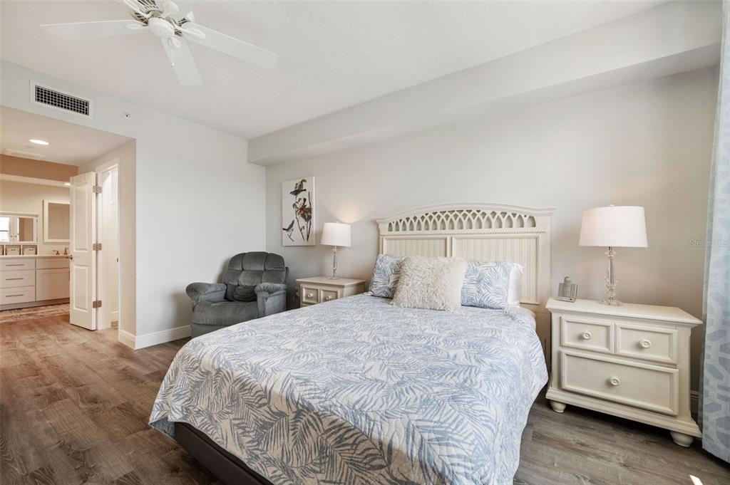 960 Starkey Road, Unit 8206 Largo, FL 33771 - Photo 24 of 71 a bedroom with a bed and a night stand