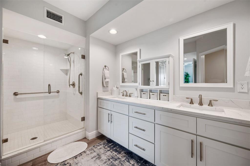 960 Starkey Road, Unit 8206 Largo, FL 33771 - Photo 27 of 71 a bathroom with a double vanity sink toilet and shower