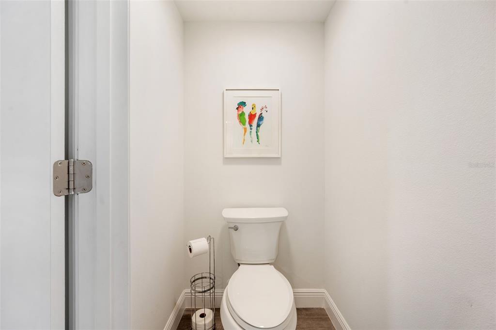 960 Starkey Road, Unit 8206 Largo, FL 33771 - Photo 29 of 71 a white toilet sitting next to a white wall