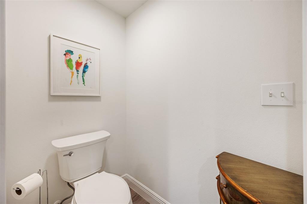 960 Starkey Road, Unit 8206 Largo, FL 33771 - Photo 30 of 71 a white toilet sitting next to a white walls
