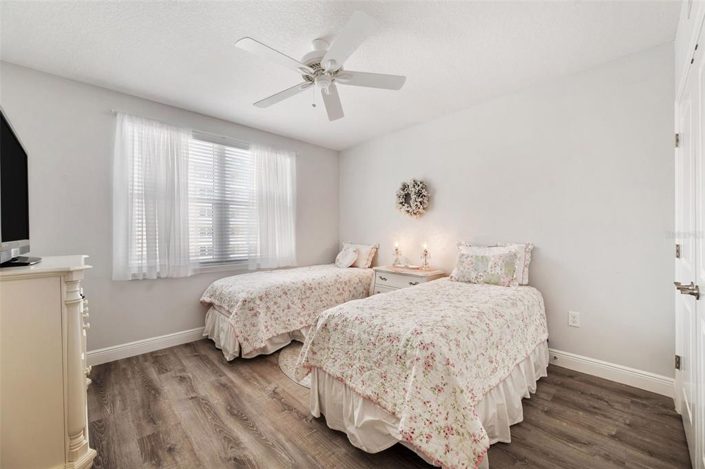 960 Starkey Road, Unit 8206 Largo, FL 33771 - Photo 34 of 71 a bedroom with two beds and a flat screen tv