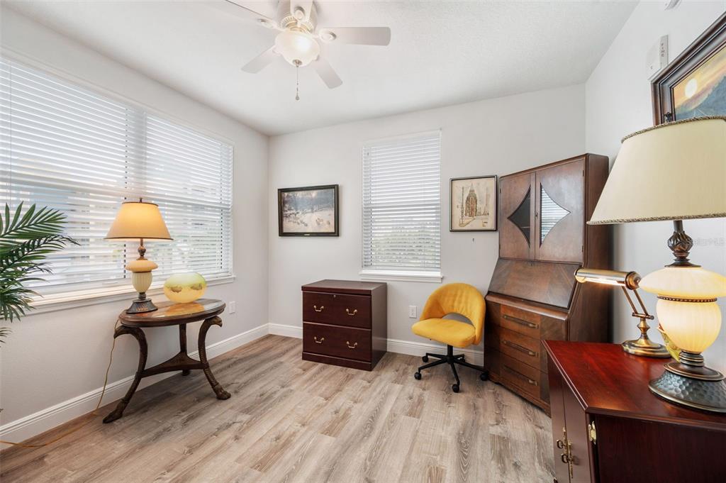 960 Starkey Road, Unit 8206 Largo, FL 33771 - Photo 36 of 71 a living room with furniture and a lamp