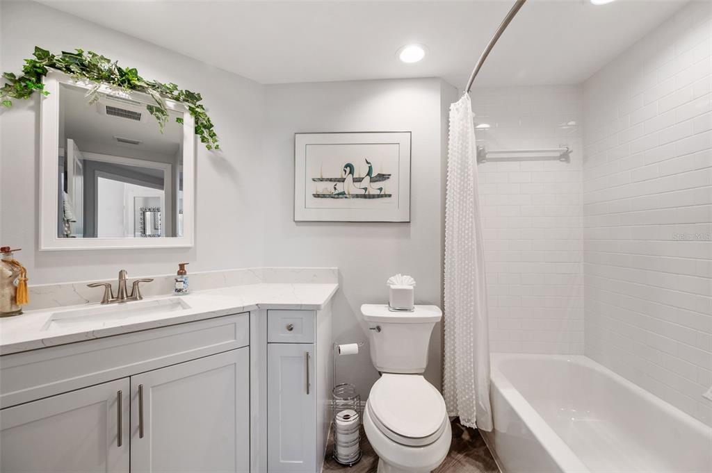 960 Starkey Road, Unit 8206 Largo, FL 33771 - Photo 40 of 71 a bathroom with a toilet sink and mirror