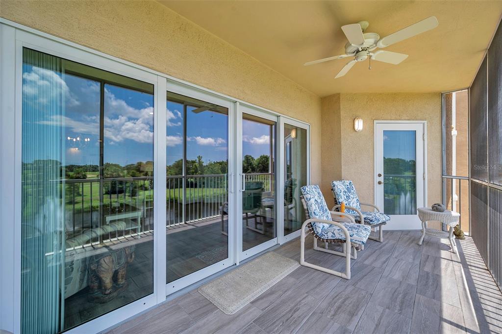 960 Starkey Road, Unit 8206 Largo, FL 33771 - Photo 56 of 71 a living room with furniture and a floor to ceiling window