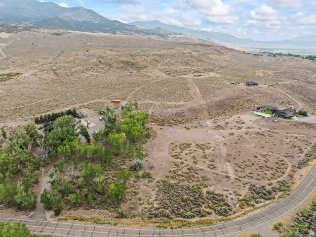 1 East Landslide Road East Monroe, UT 84754 - Photo 12 of 19 Expansive rural acreage with scattered trees and a winding paved road