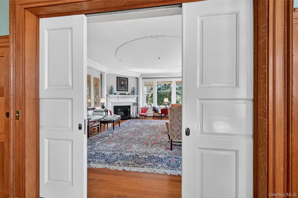 a view of living room with furniture and a fireplace