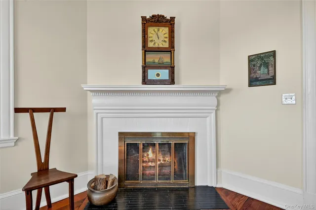 a living room with a fireplace and a window