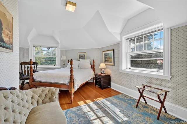 a bed room with a bed and a window