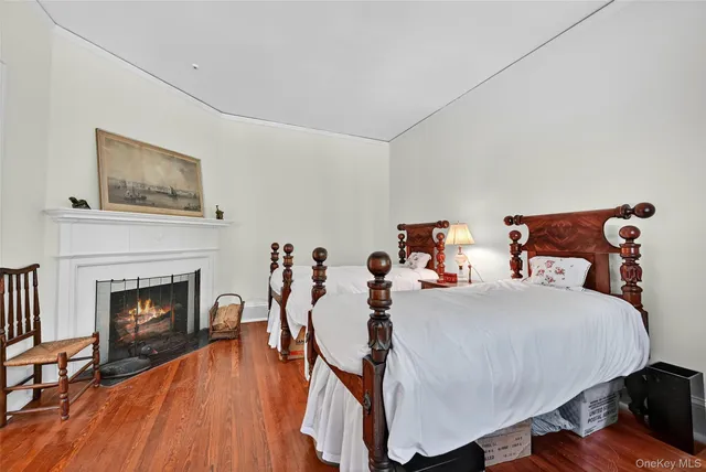 a bedroom with furniture and a fireplace