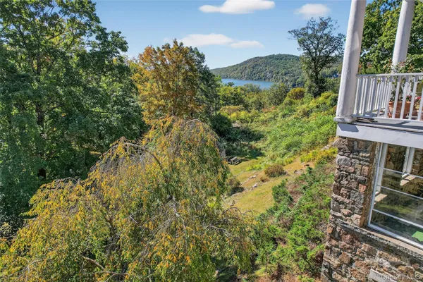 a view of balcony with wooden floor and fence