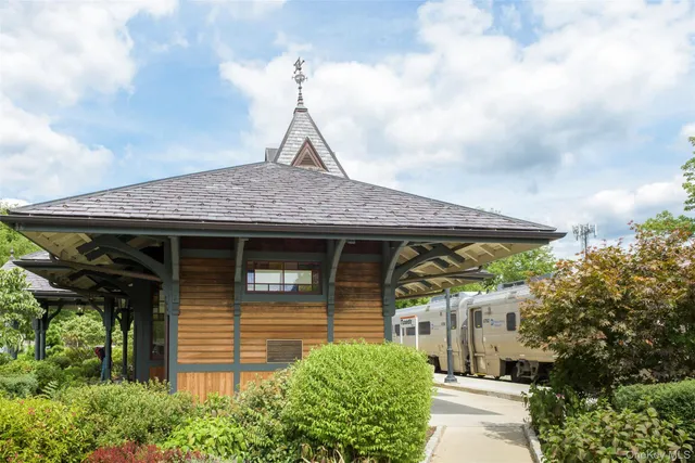 a view of a big yard with a large trees