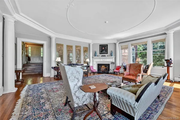 a living room with furniture a fireplace and a table