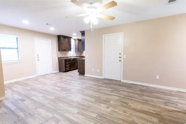 a view of a kitchen with a sink and a stove top oven