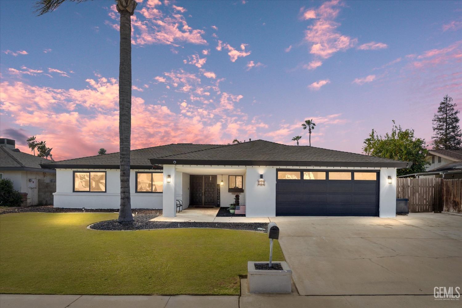 a front view of a house with swimming pool having outdoor seating