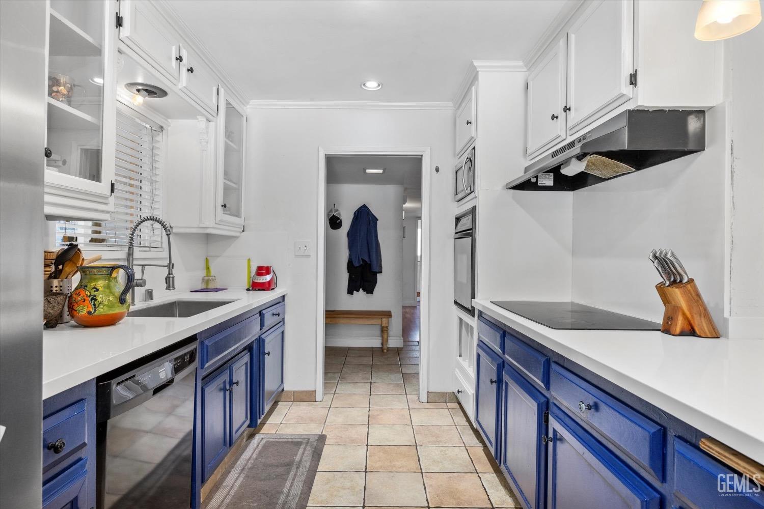 Undisclosed Address Bakersfield, CA 93309 - Photo 16 of 36 a kitchen with stainless steel appliances a sink and a refrigerator