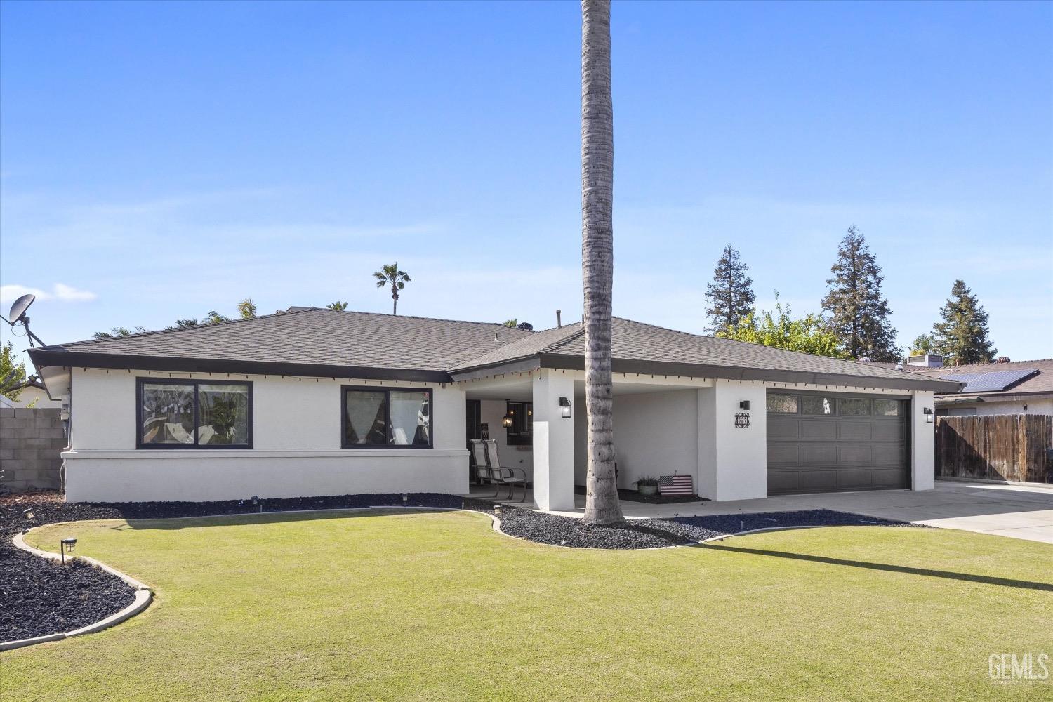 Undisclosed Address Bakersfield, CA 93309 - Photo 2 of 36 a view of a house with pool and a yard