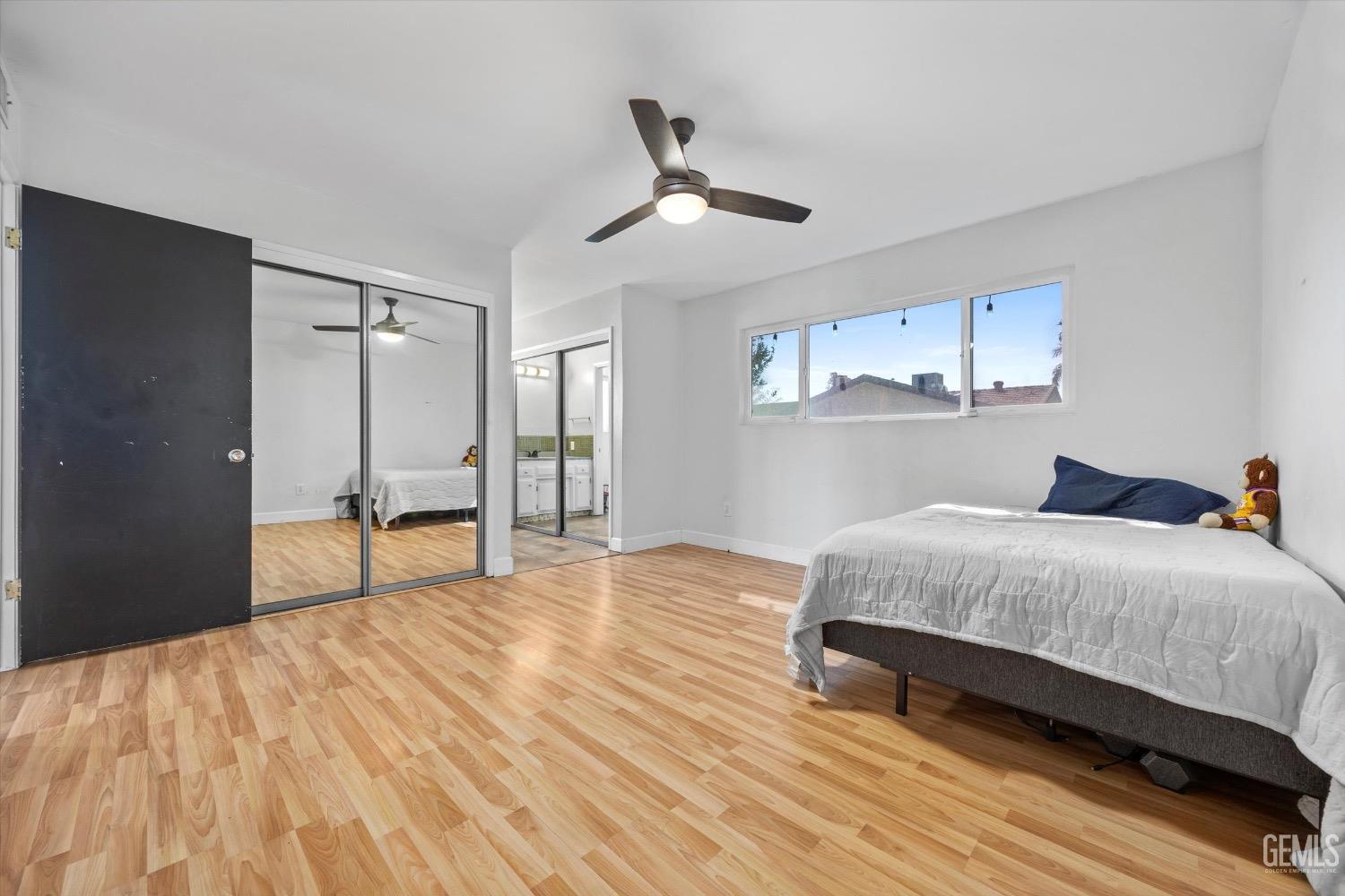 Undisclosed Address Bakersfield, CA 93309 - Photo 21 of 36 a bedroom with a bed and a table