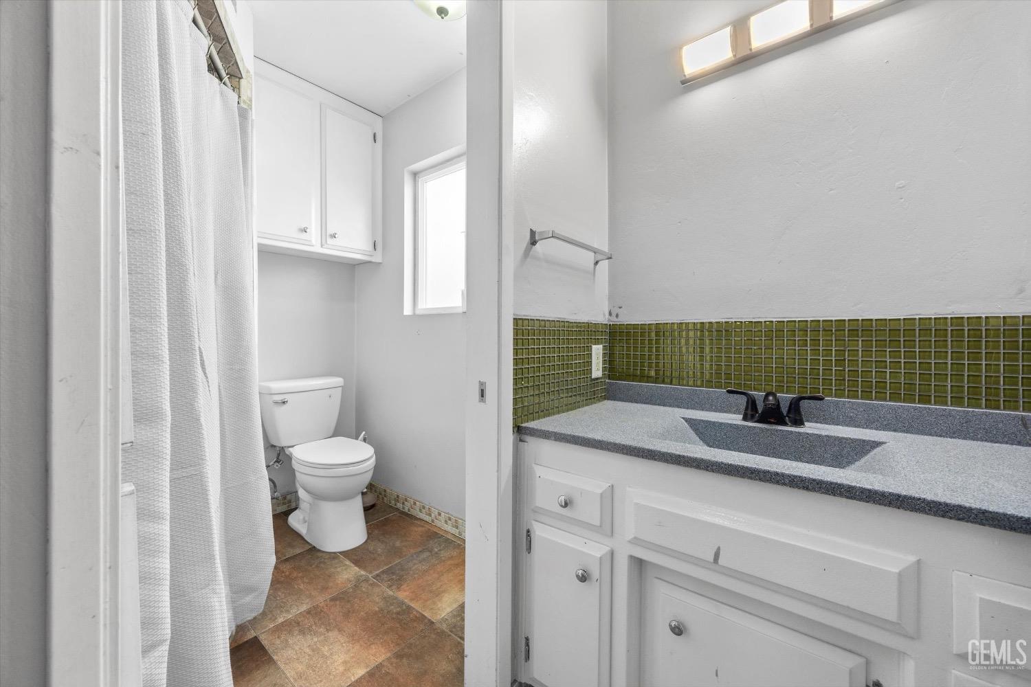 Undisclosed Address Bakersfield, CA 93309 - Photo 23 of 36 a bathroom with a sink and a toilet