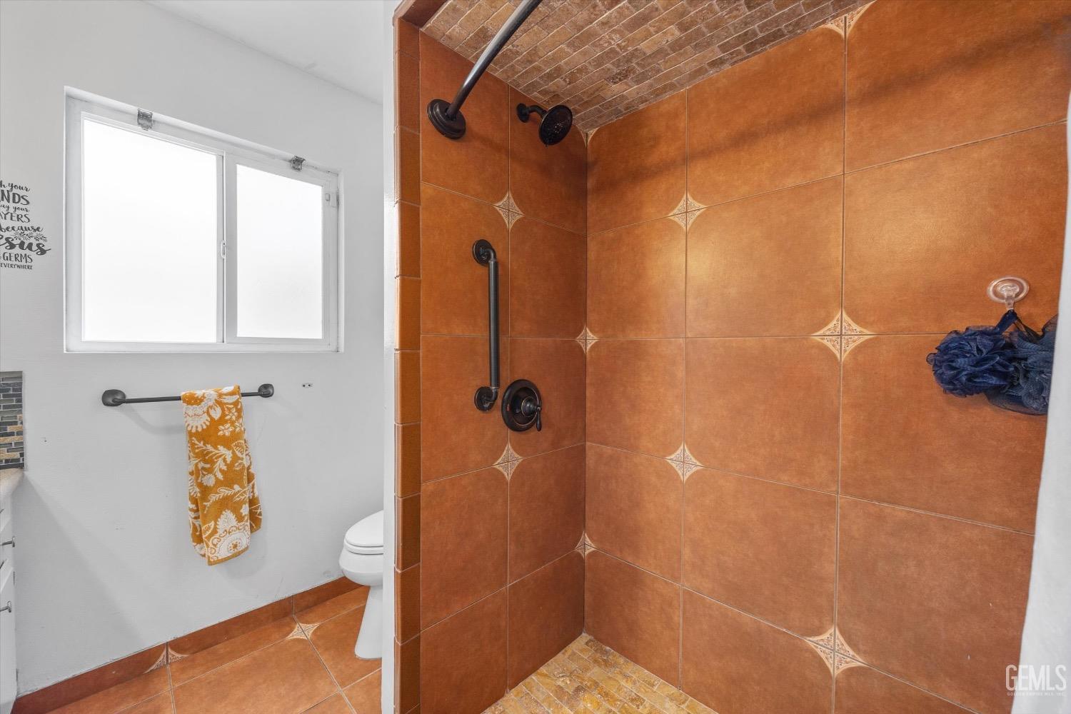 Undisclosed Address Bakersfield, CA 93309 - Photo 27 of 36 a bathroom with a shower