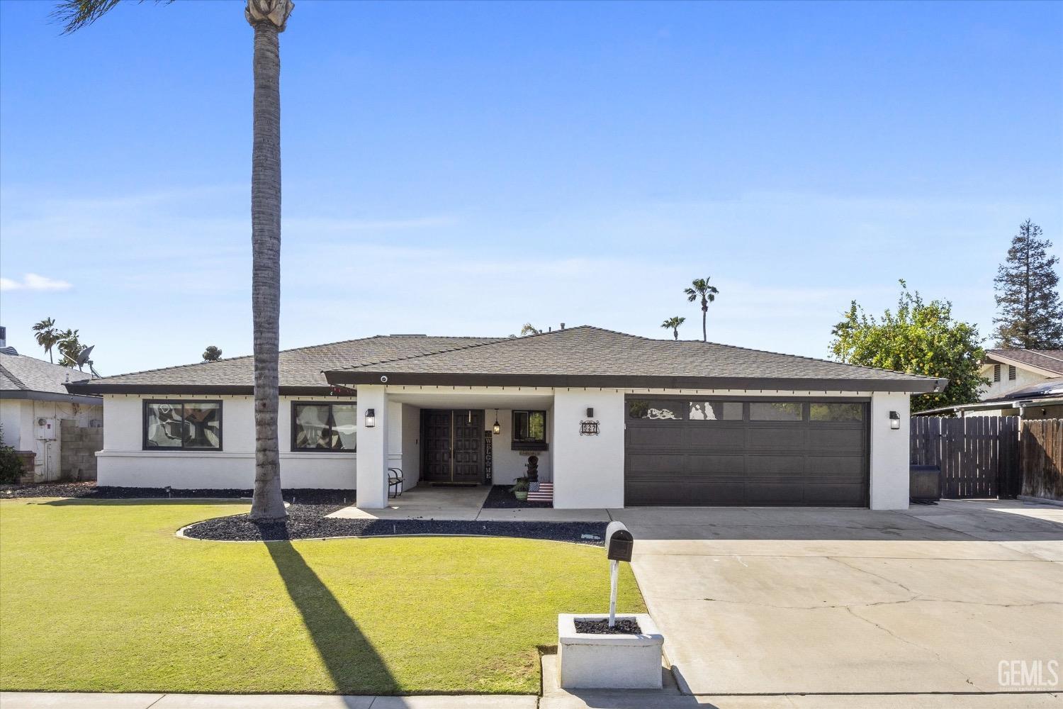 Undisclosed Address Bakersfield, CA 93309 - Photo 3 of 36 a view of a house with pool and chairs