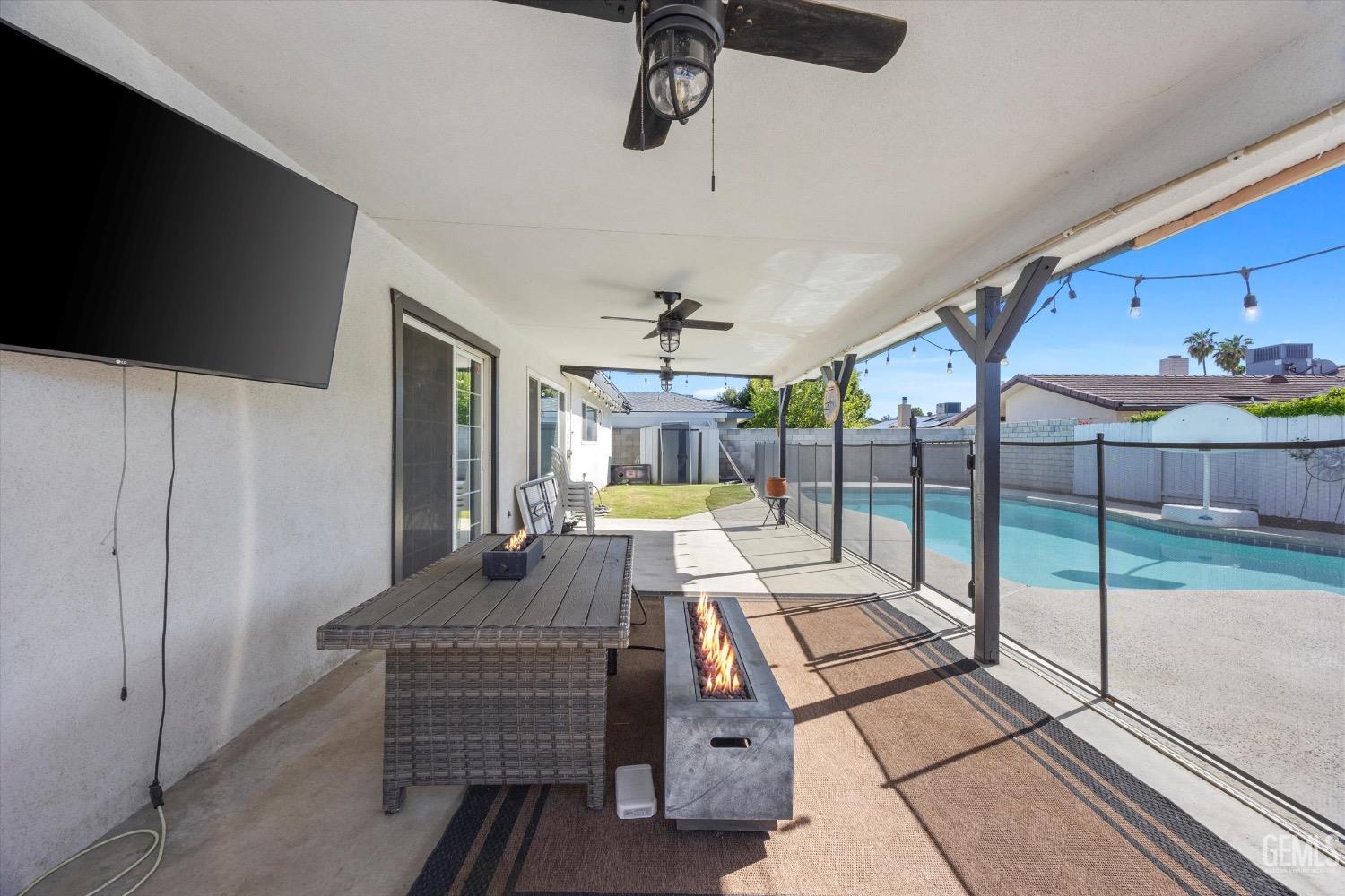Undisclosed Address Bakersfield, CA 93309 - Photo 31 of 36 a view of living room with furniture and flat screen tv