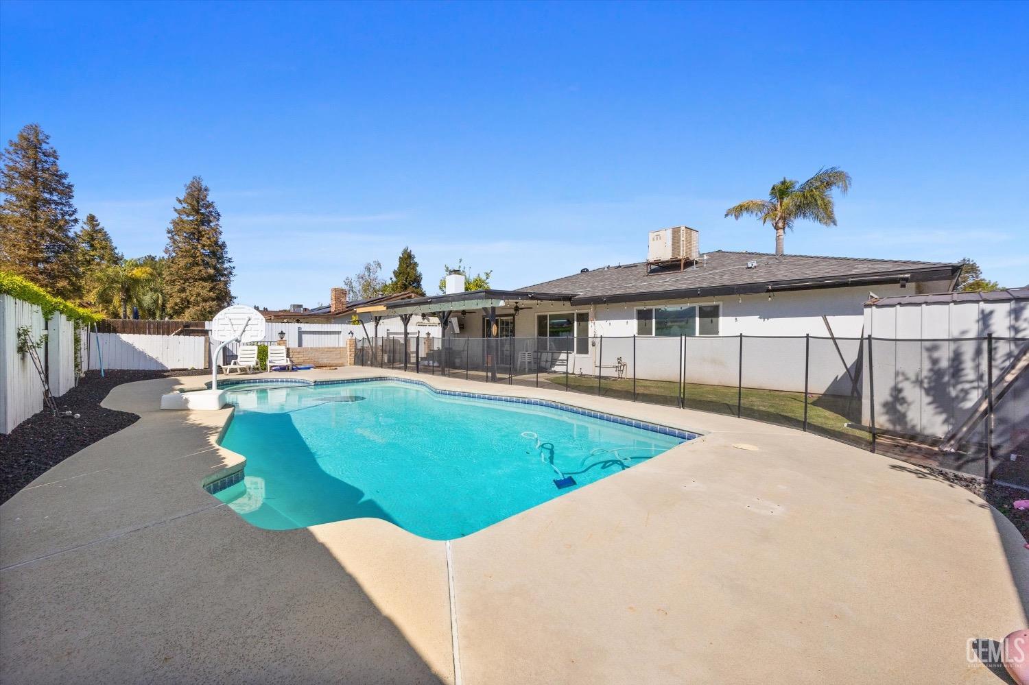Undisclosed Address Bakersfield, CA 93309 - Photo 33 of 36 a view of a house with a swimming pool