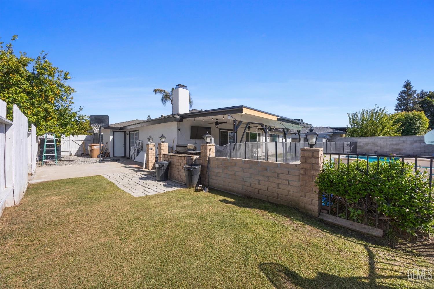 Undisclosed Address Bakersfield, CA 93309 - Photo 36 of 36 a view of a house with a swimming pool