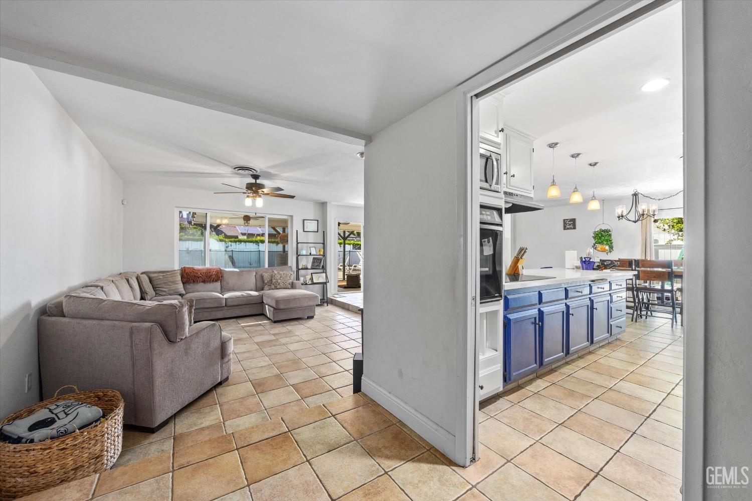 Undisclosed Address Bakersfield, CA 93309 - Photo 6 of 36 a living room with furniture and a large window