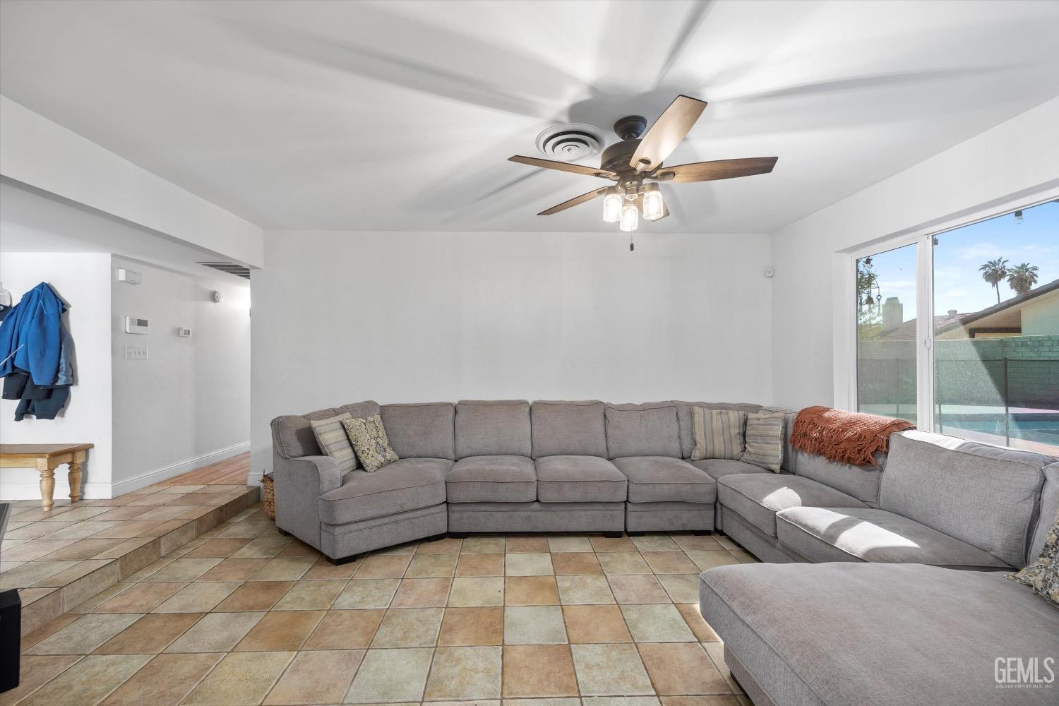 Undisclosed Address Bakersfield, CA 93309 - Photo 9 of 36 a living room with furniture and a couch