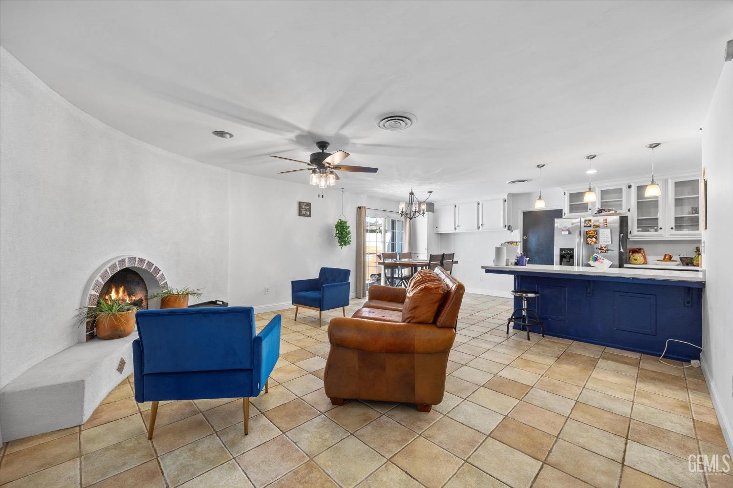 Undisclosed Address Bakersfield, CA 93309 - Photo 10 of 36 a living room with furniture and a kitchen view