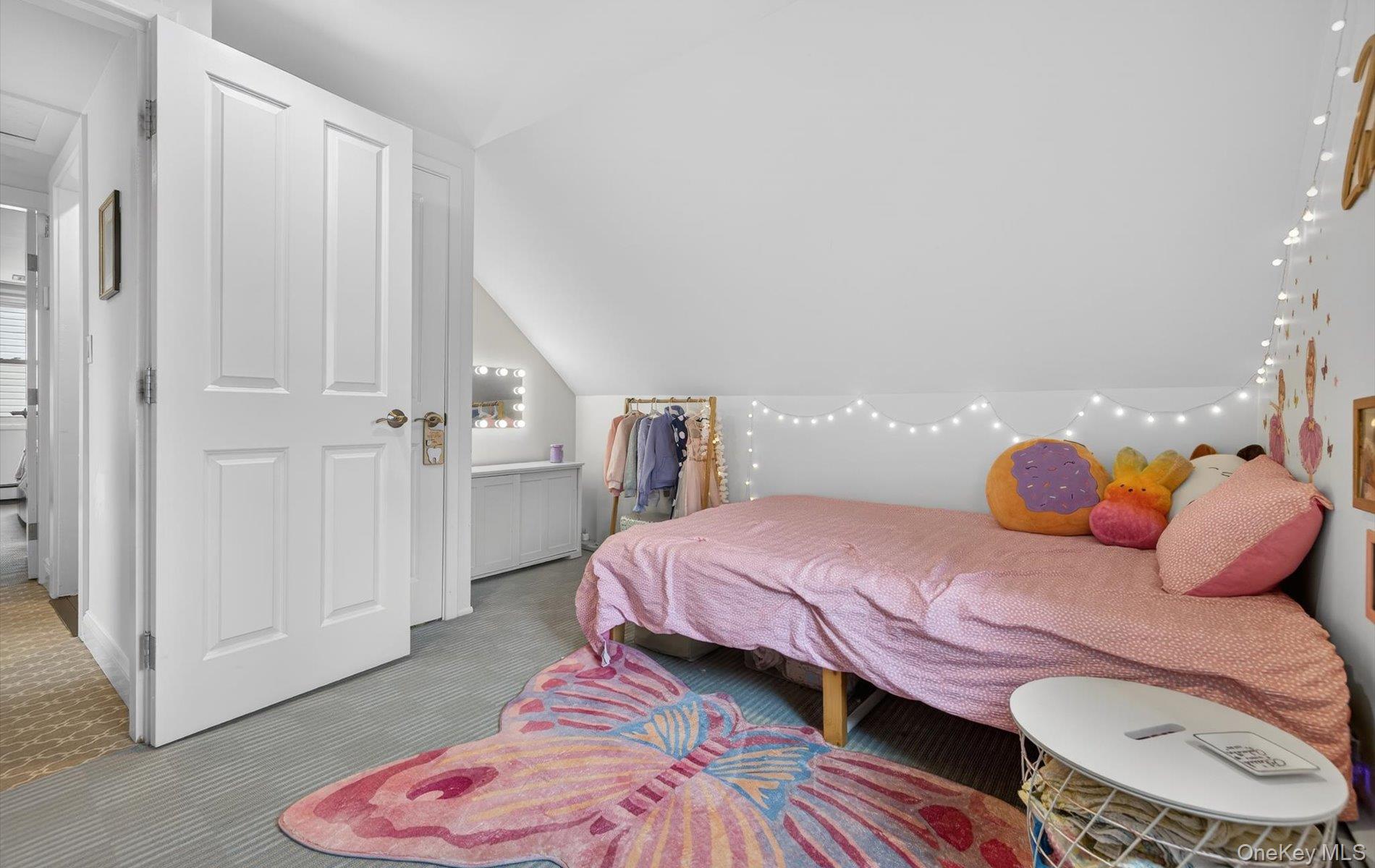 28 Harbor Road Port Washington, NY 11050 - Photo 14 of 22 a bedroom with a bed and wooden floor