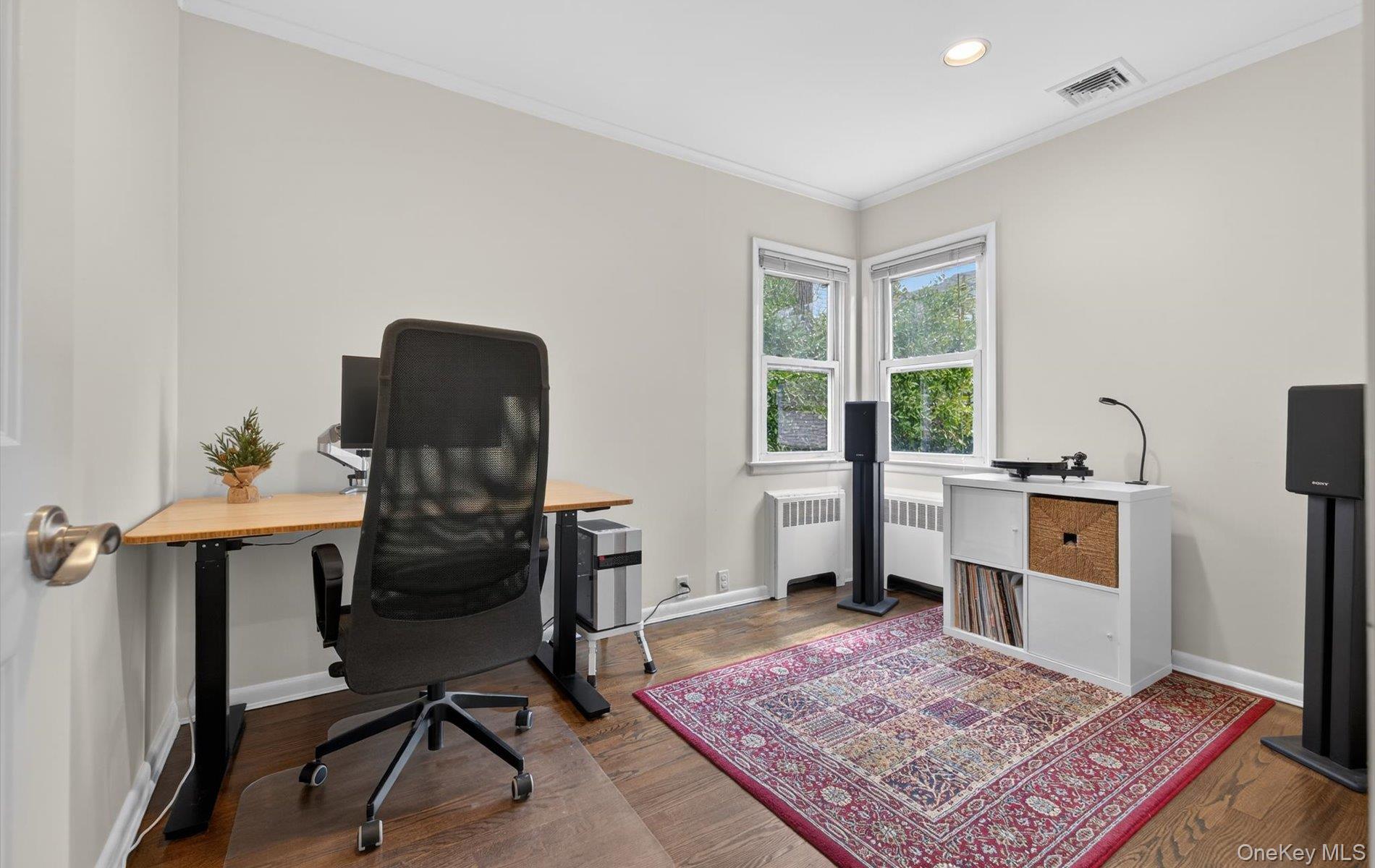 28 Harbor Road Port Washington, NY 11050 - Photo 17 of 22 a view of a workspace with furniture and a rug