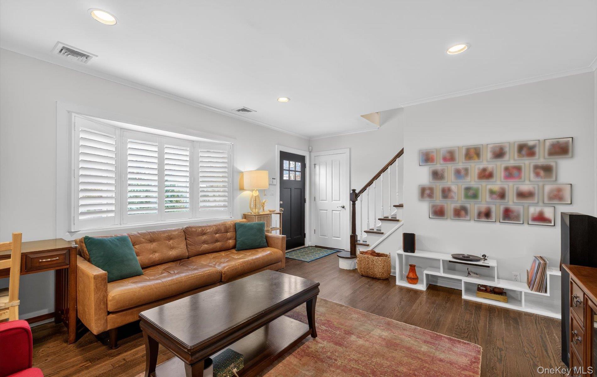 28 Harbor Road Port Washington, NY 11050 - Photo 3 of 22 a living room with furniture and a large window