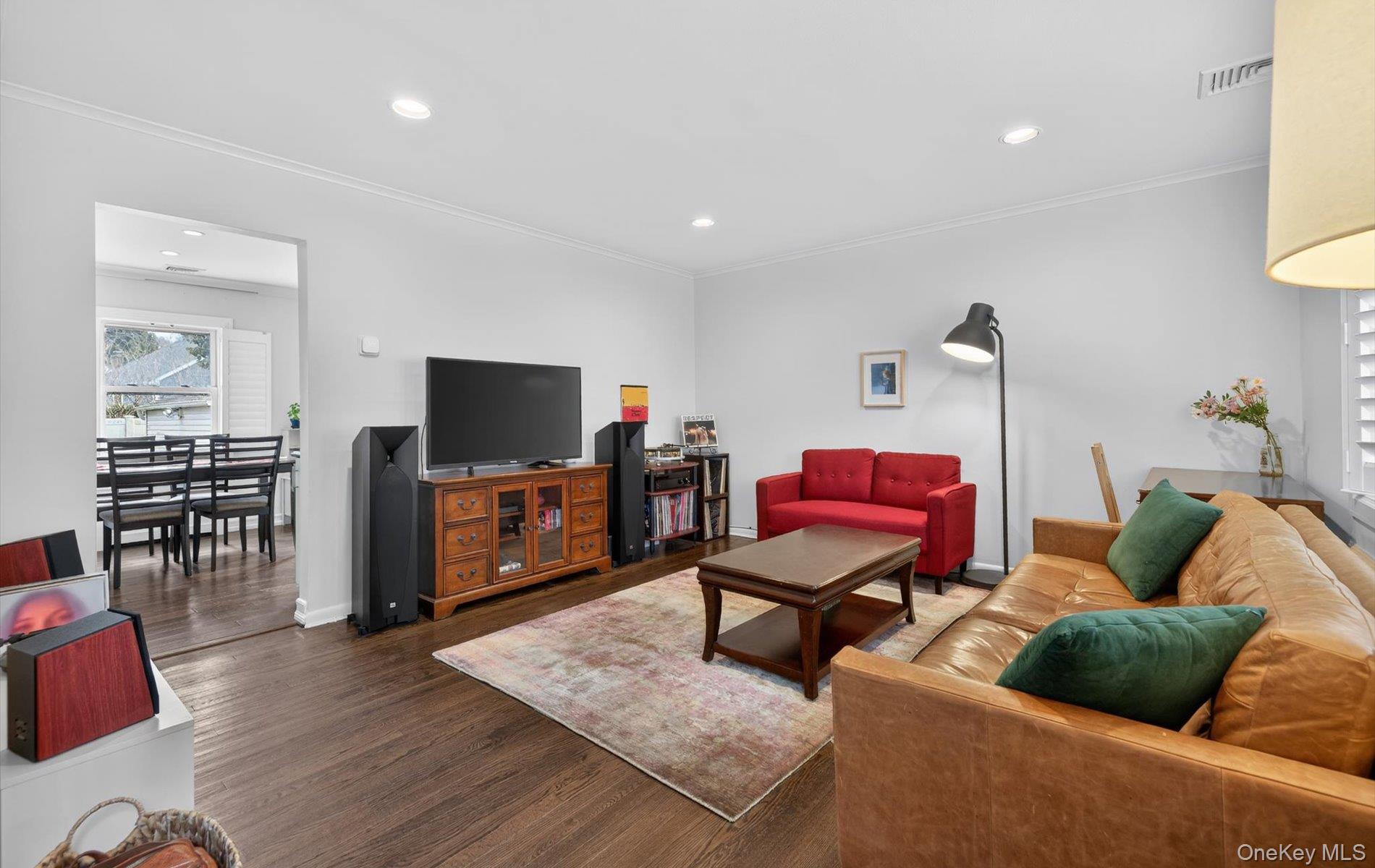 28 Harbor Road Port Washington, NY 11050 - Photo 4 of 22 a living room with furniture and a flat screen tv