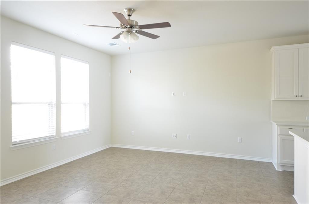 14403 McCoy Loop Austin, TX 78717 - Photo 11 of 29 A well-lit area with neutral tones and durable tile flooring awaits your personal touch.
