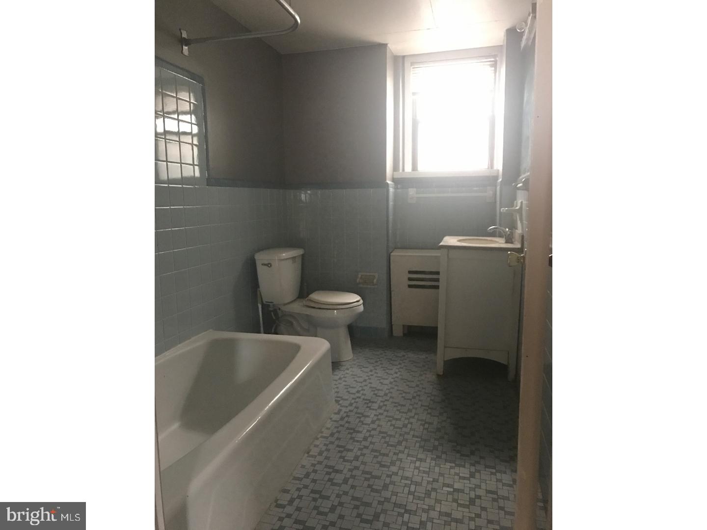 1321 Spruce Street, Unit 1E Philadelphia, PA 19107 - Photo 11 of 22 a bathroom with a toilet and a bathtub