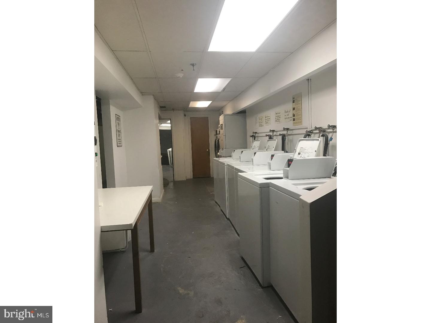 1321 Spruce Street, Unit 1E Philadelphia, PA 19107 - Photo 17 of 22 a room with a sink storage and utility room