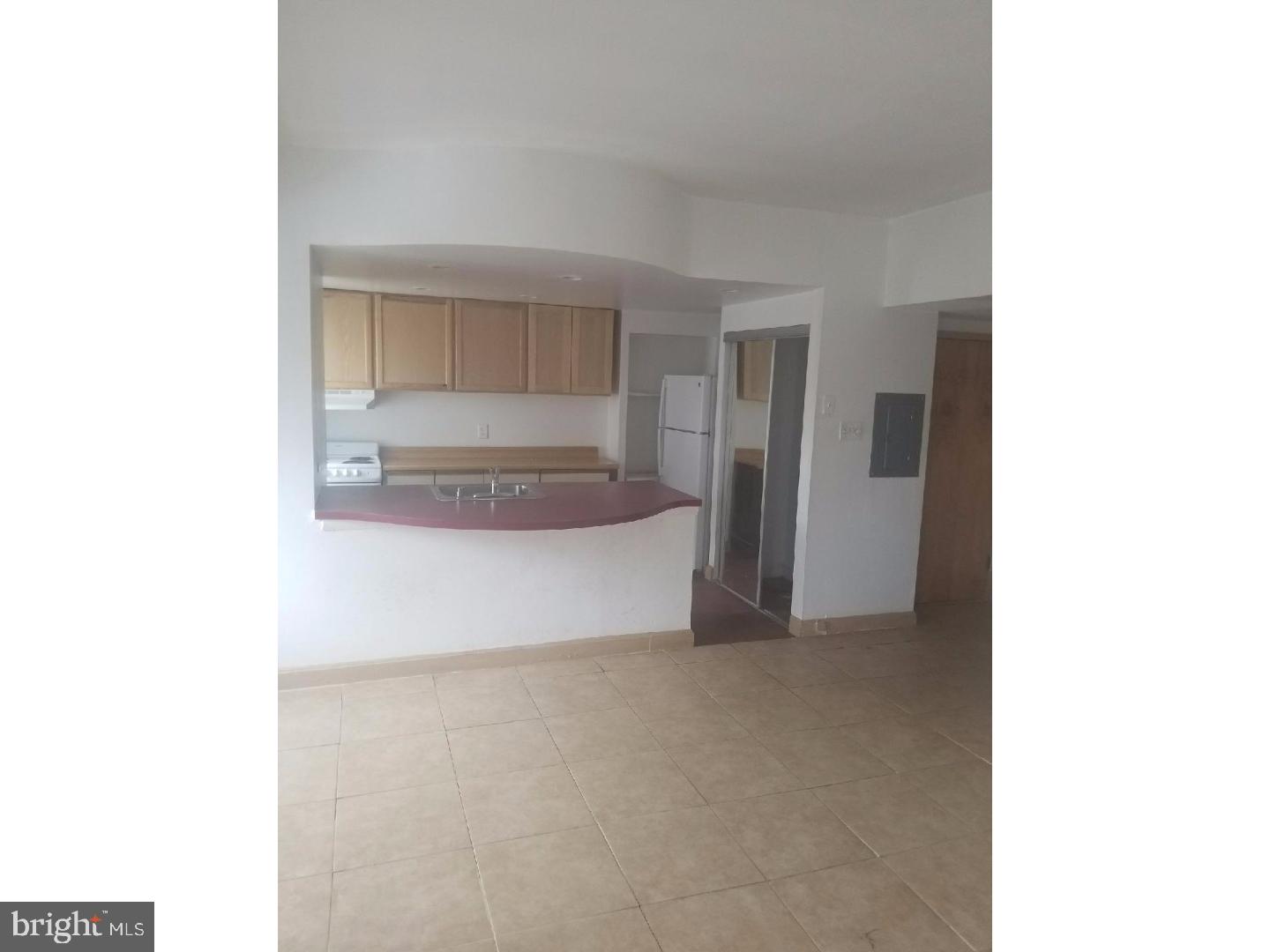 1321 Spruce Street, Unit 1E Philadelphia, PA 19107 - Photo 19 of 22 a view of an empty room with a window