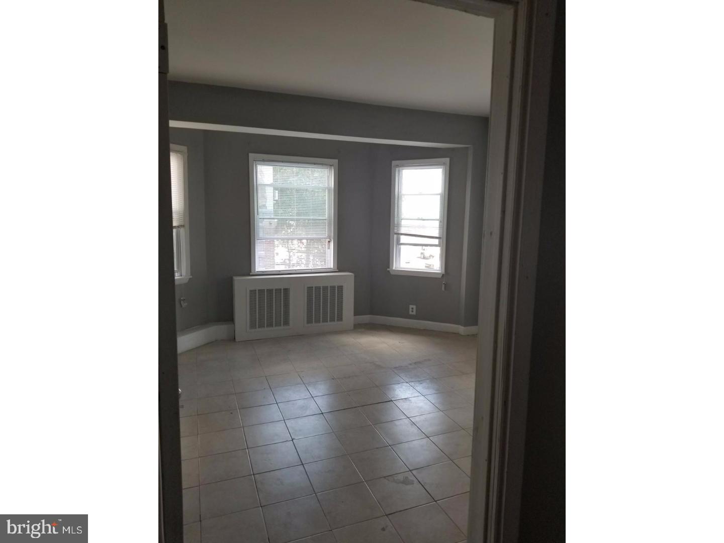1321 Spruce Street, Unit 1E Philadelphia, PA 19107 - Photo 20 of 22 a view of an empty room with a kitchen