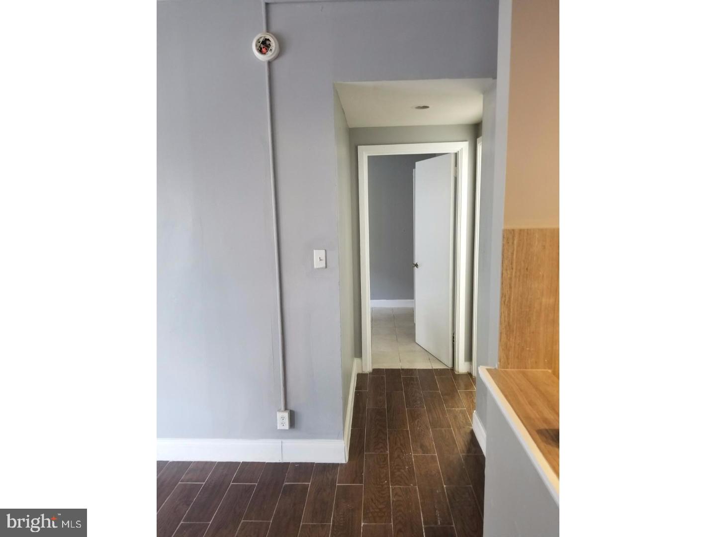 1321 Spruce Street, Unit 1E Philadelphia, PA 19107 - Photo 22 of 22 a view of a hallway with wooden floor