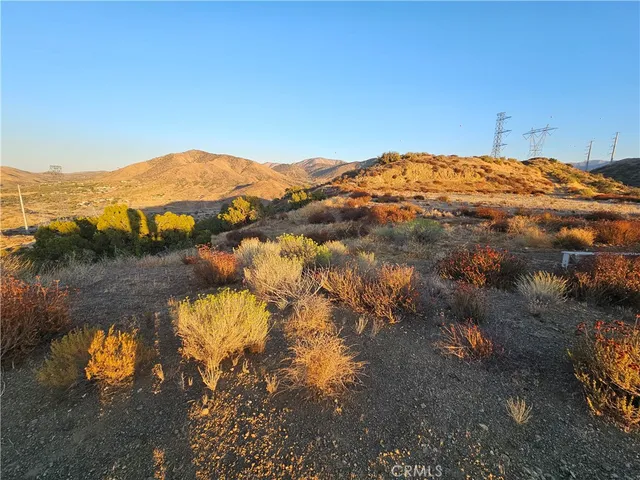 a view of a town with mountains in the background