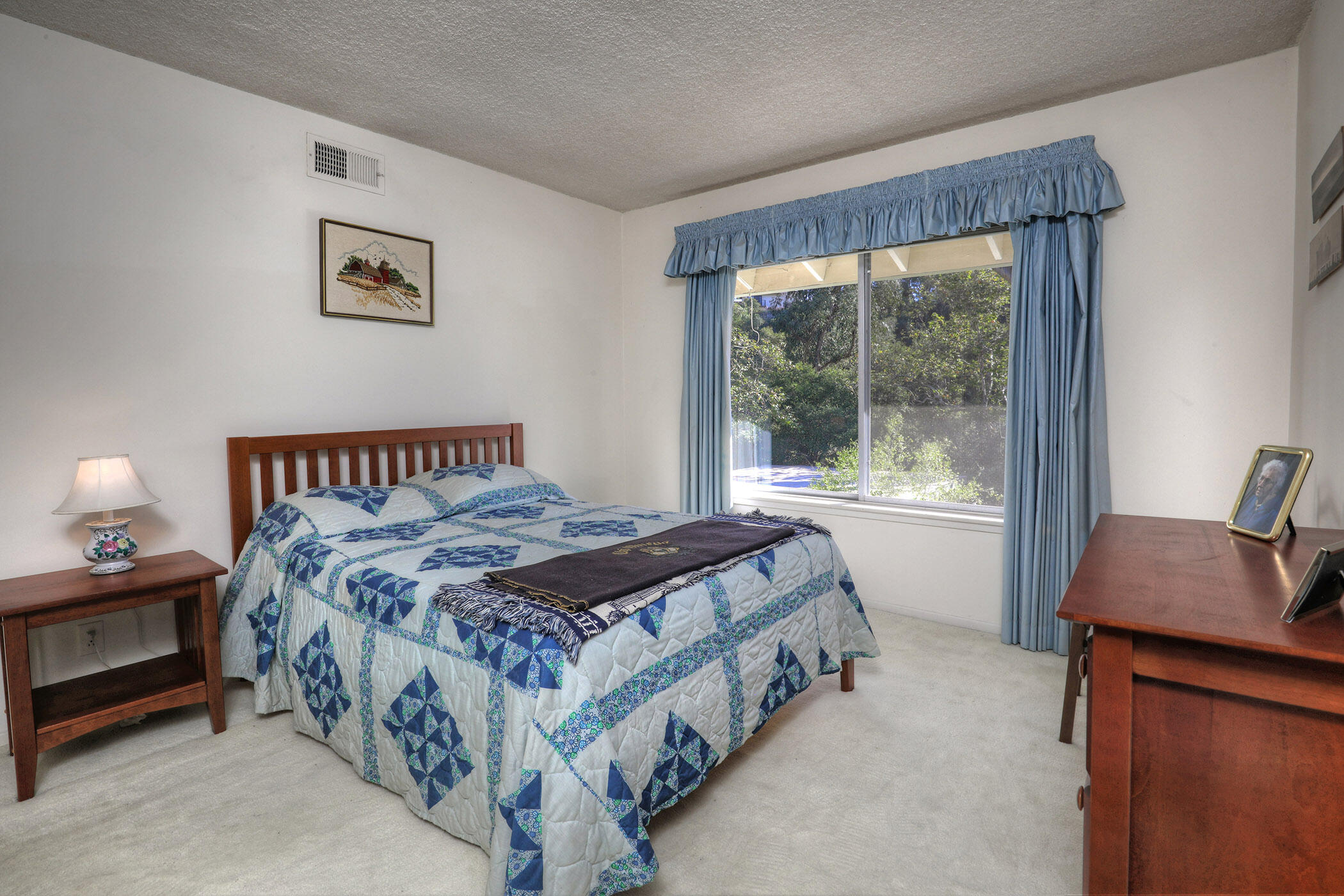 2805 Miradero Drive, Unit C Santa Barbara, CA 93105 - Photo 13 of 23 a bedroom with a bed lamp and window