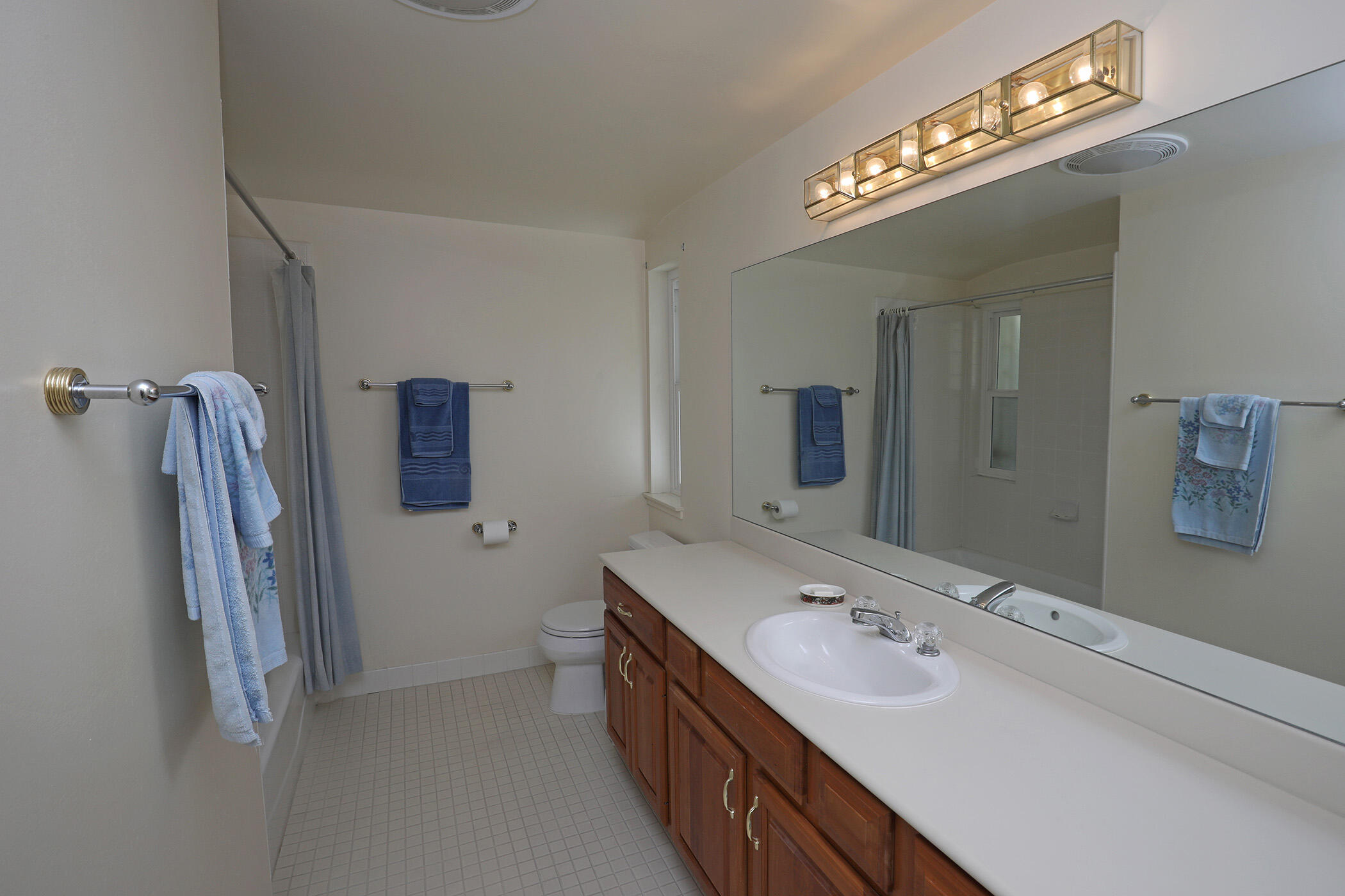 2805 Miradero Drive, Unit C Santa Barbara, CA 93105 - Photo 14 of 23 a bathroom with double vanity and a mirror