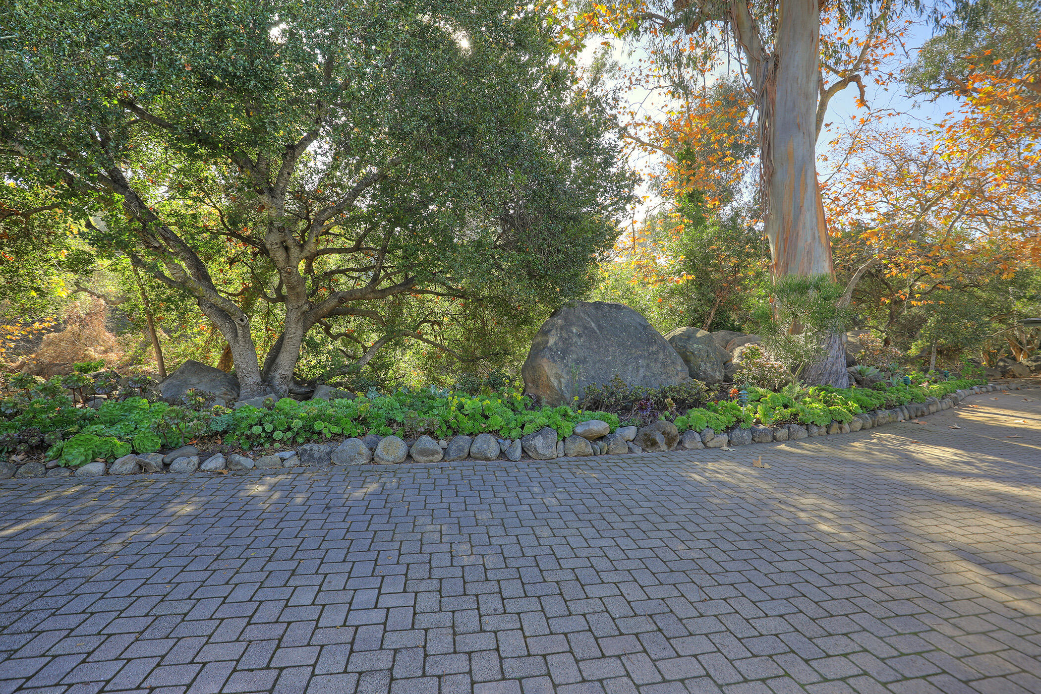 2805 Miradero Drive, Unit C Santa Barbara, CA 93105 - Photo 22 of 23 a backyard of a house with lots of green space and trees