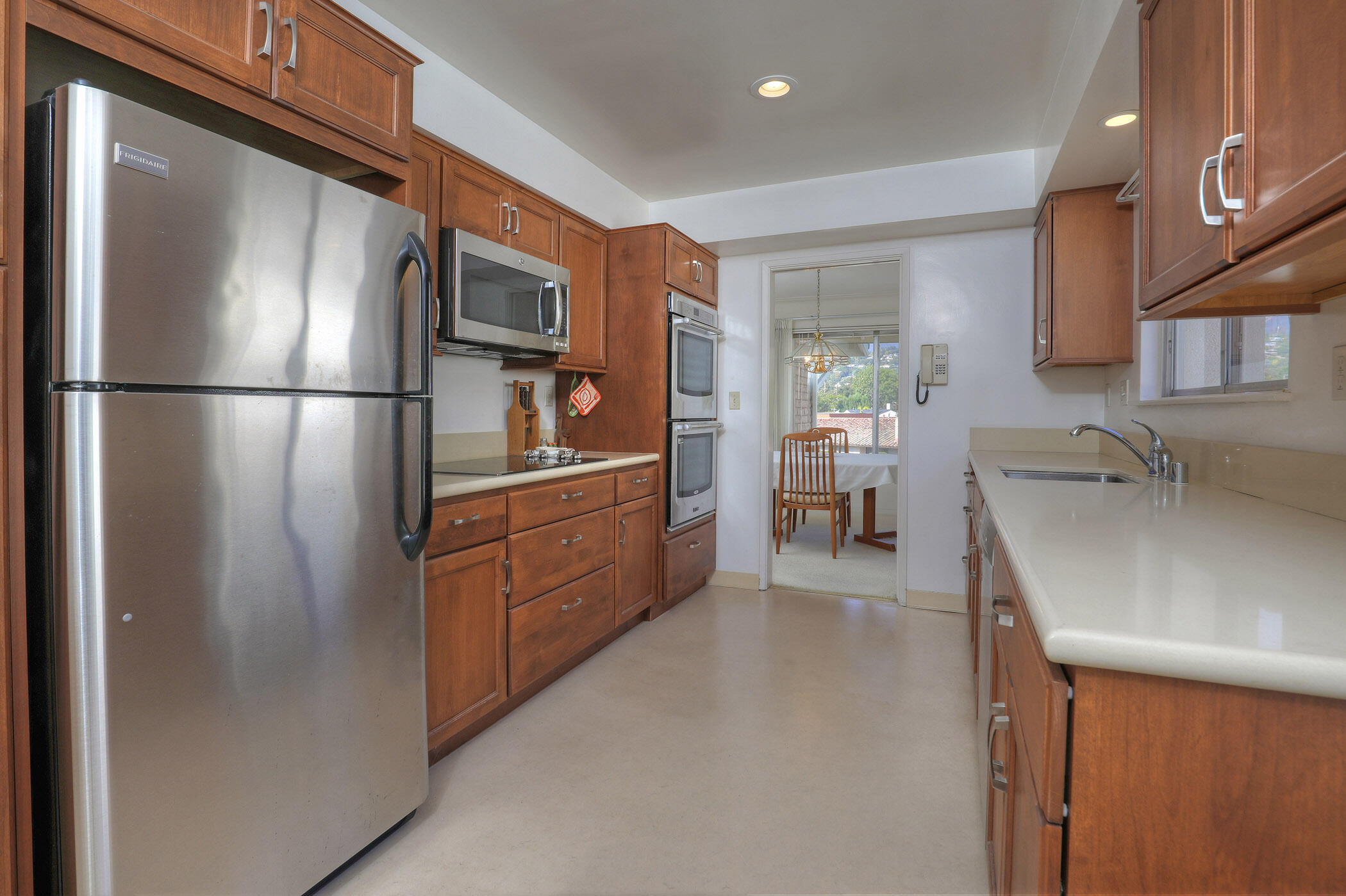 2805 Miradero Drive, Unit C Santa Barbara, CA 93105 - Photo 8 of 23 a kitchen with stainless steel appliances granite countertop a refrigerator and a sink