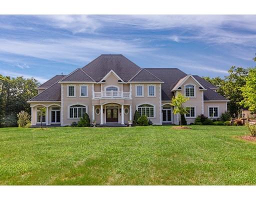 11 Bramble Lane Sharon, MA 02067 - Photo 1 of 30 a front view of a house with a garden
