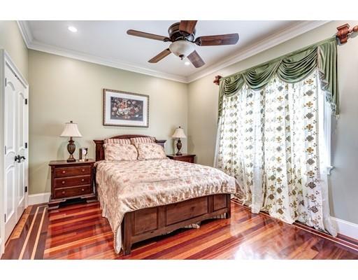 11 Bramble Lane Sharon, MA 02067 - Photo 12 of 30 a bedroom with a bed and a chandelier