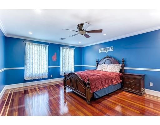 11 Bramble Lane Sharon, MA 02067 - Photo 19 of 30 a spacious bedroom with a bed and wooden floor