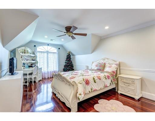 11 Bramble Lane Sharon, MA 02067 - Photo 21 of 30 a bedroom with a bed a chandelier and dresser
