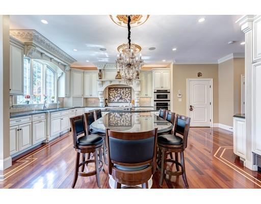 11 Bramble Lane Sharon, MA 02067 - Photo 7 of 30 a view of a dining room with furniture wooden floor and chandelier